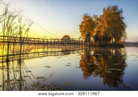 Morning Landscape, Wooden Hunting Lodge, On A Small Man-made Island. A Wooden Platform Is Coming To 