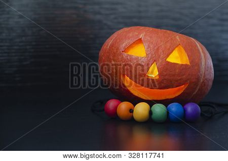 Pumpkin Carving Jack Lantern Head Orange Halloween, Lgbt Beads On A Black Background. Copy Space