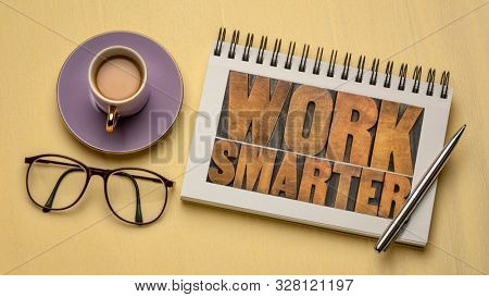 work smarter word abstract - motivational advice or reminder - text in letterpress wood type in a sketchbook with coffee, business productivity and efficiency concept