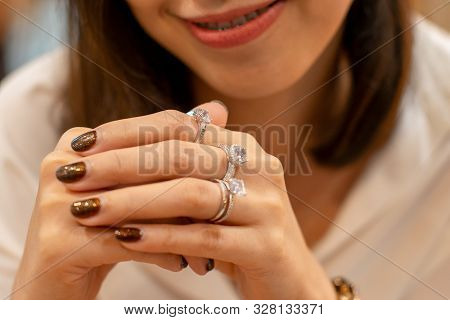 Close Up Of An Elegant Diamond Rings On Woman Finger,(soft And Sellective Focus)