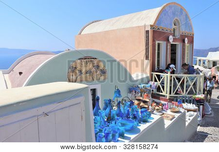 Santorini, Greece, Europe - 8/4/2019 - Glassware And Souveneirs For Sale At A Market In Santorini, G
