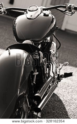 Umea, Sweden - August 27, 2019: A Classic Motorcycle Seen From Behind With Polished Metal Surfaces