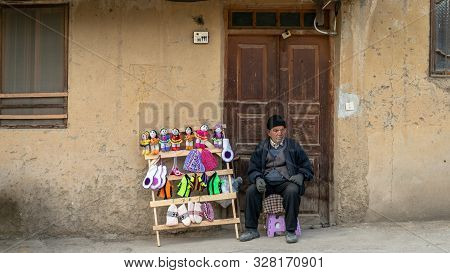Masuleh, Iran - May 2019: Iranian Old Man Selling Hand Made Crafts For Tourists