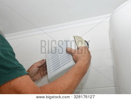 Handyman Installing New Bath Vent Fan, Ventilation System In The House Bathroom . Bath Fan Repair, I