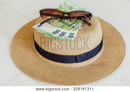 Sun Hat With Sunglasses And 100 Hundredth Euro Banknotes. Money Or Vacation Concept