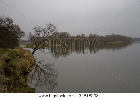 Beautiful Polish Autumn Cold Gray Cloudy November Landscape Of Podlasie With The River Bug
