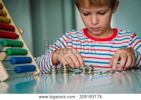 Child Counting Money And Make Tower From Coints, Boy Make Savings