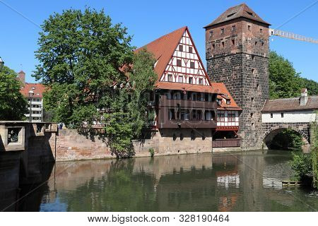 Nuremberg City, Germany - Wasserturm Medieval Tower And Henkersteg Bridge.