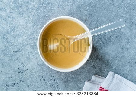 Take Away Asian Food Wonton Soup With Bok Choy And Chives In Plastic Bowl Package Or Container Box.
