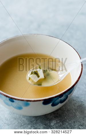 Japanese Food Miso Soup With Tofu And Seaweed In Ceramic Bowl.