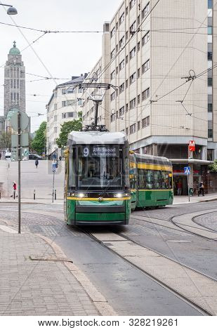 Helsinki, Finland - May 23, 2019: Skoda New Green Tram On Helsinki Street Turns Against The Backdrop