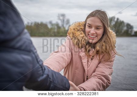 Young Couple Has Fum And Romp Around At The Water