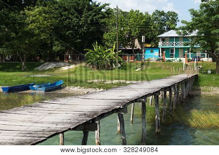 Long Dock Along The Lake Itza At A Sunny Day, El Remate, Guatemala