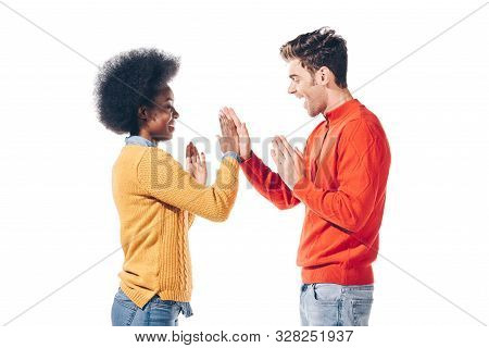 Beautiful Multicultural Couple In Winter Clothes Giving Highfive, Isolated On White