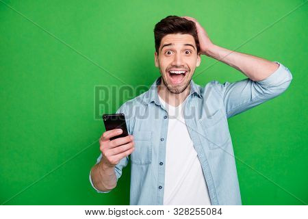Photo Of Cheerful Brunet Haired Excited Crazy Casual Man Holding Telephone Rejoicing With Feednews R