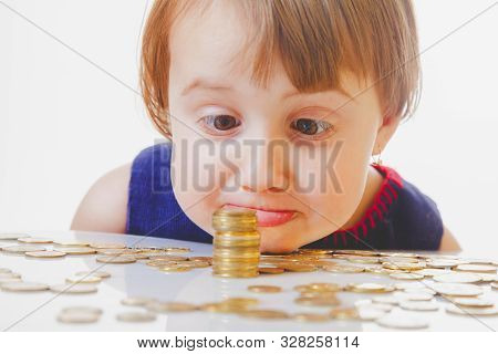 Best Motivation Is Money. Little Child Girl With Coints.