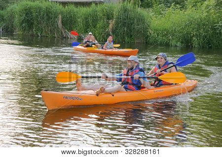 Two Men On A Kayak, Tourists Rafters In A Blue Boat, Matrosovka River, Polessky District, Kaliningra