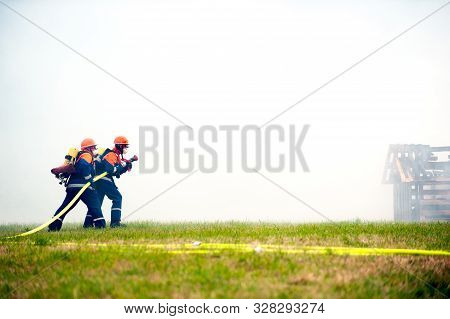 Germany, Niederstetten, Baden Wurttemberg. September 2019 Young Firefighters In Training With Fire H