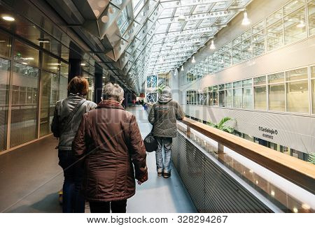 Strasbourg, France - Nov 23, 2017: Rear View Of Senior Patients Walking Inside The Nhc Nouvel Hopita