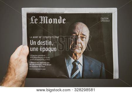 Paris, France - Man Hand Holding Le Monde French Newspaper Special Edition With Jacques Chirac Forme