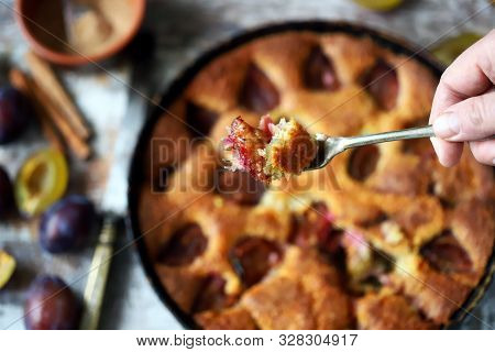 Selective Focus. Slice Of Plum Pie On A Fork. Homemade American Plum Pie. Macro.