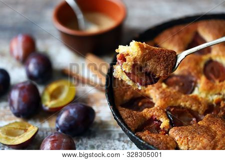 Selective Focus. Slice Of Plum Pie On A Fork. Homemade American Plum Pie. Macro.