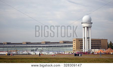 Berlin, Germany - October 10, 2018: Cyclist At Radar Tower In Public City Park Tempelhofer Feld, For