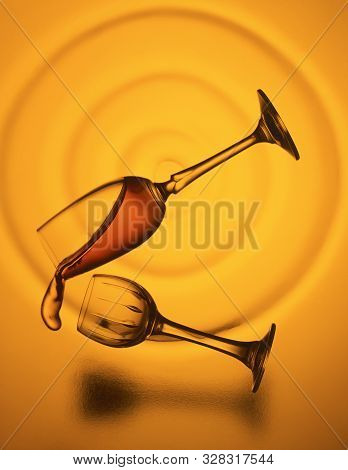 Glasses Falling Over In A Spiral And Liquid Pouring Out