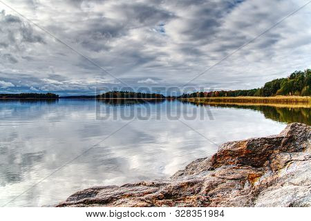 Pleasant Landscape, Nature, Sea View. The Sky In Thick Rain Clouds, The Rocky Shore And The Baltic S