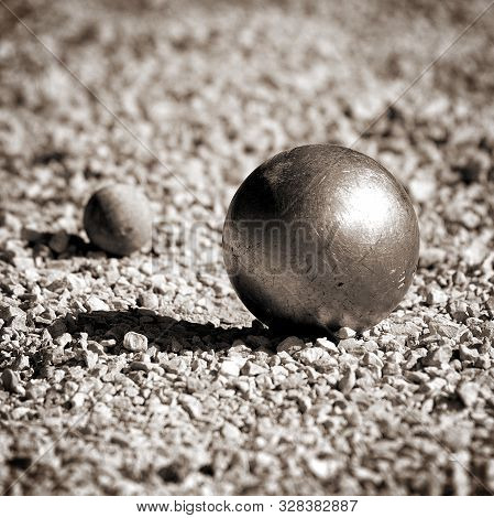 Closeup Of A Petanque Ball And The Cochonnet