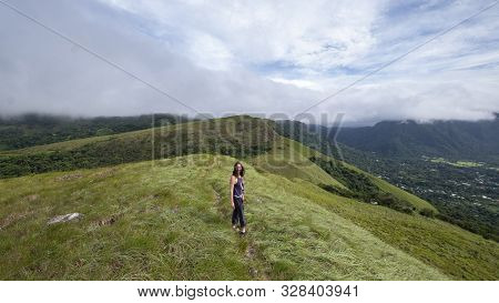 Female Hiker Walking Along The Ridge On Top Of India Dormida Mountain In El Valle De Aton, Panama
