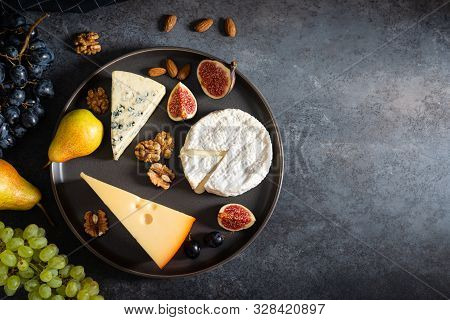 Cheese Plate: Maasdam, Camembert Cheese, Blue Cheese, Figs, Walnuts, Almonds, Pears And Grapes On Th