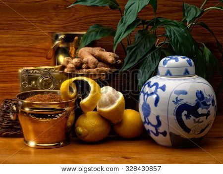 An Asian Theme With A Dragon Bowl, Ginger, Lemons And Sugar