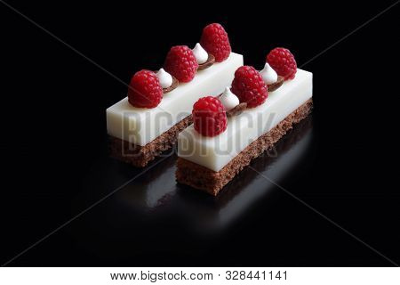 White Mousse Desserts With Raspberries And Meringues On Brownie Base