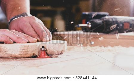 A Carpenter Is Chamfers An Edge From A Compartmental Dish On Milling Cutter