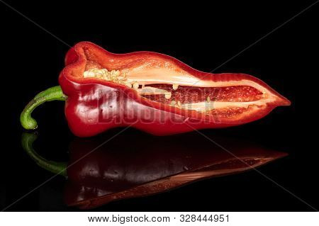 One Half Of Sweet Red Bell Pepper Isolated On Black Glass