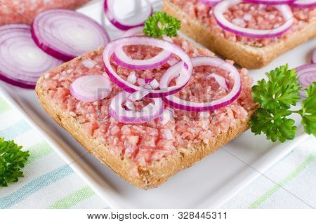 German Food Mett Ground Pork, Bun And Raw Meat With Onion And Parsley, Closeup