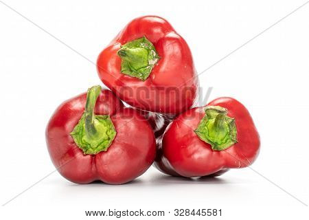 Group Of Three Whole Sweet Red Bell Pepper Isolated On White Background