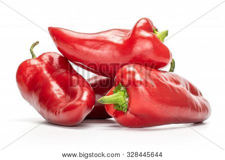 Group Of Four Whole Sweet Red Bell Pepper Isolated On White Background