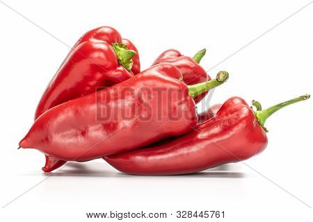 Group Of Four Whole Bright Sweet Red Bell Pepper Isolated On White Background