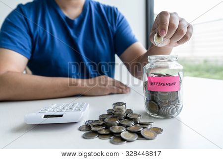 Man Putting Coins To Planning Growing Saving To Strategy With Money Box For Future Plan Fund Of Trav