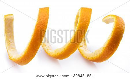 Orange peel or orange twist on white background. Close-up.