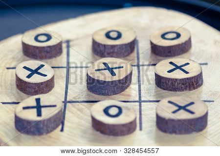 Wooden Game Tic Tac Toe. Focus Winner. Background With Blur. Business Thinking Winner. Creative Thin