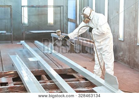 industrial painter in chamber painting metal detail