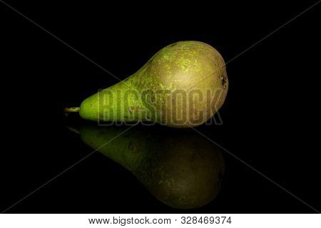 One Whole Fresh Green Pear Isolated On Black Glass