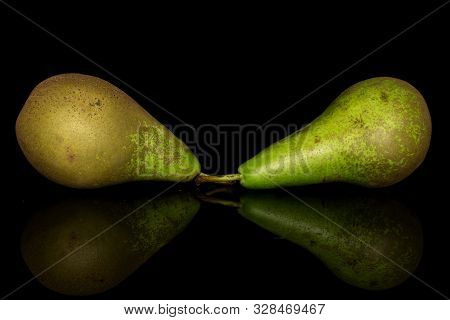 Group Of Two Whole Fresh Green Pear Isolated On Black Glass