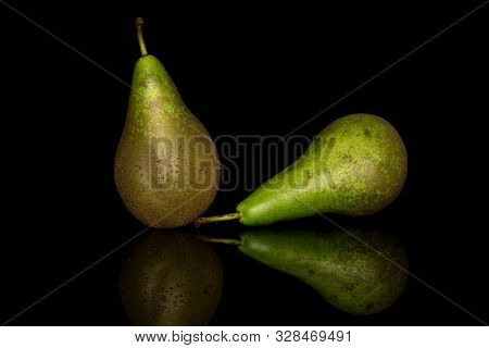 Group Of Two Whole Fresh Green Pear Front Focus Isolated On Black Glass