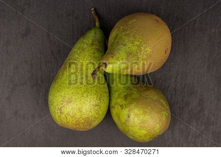 Group Of Three Whole Fresh Green Pear Flatlay On Grey Stone