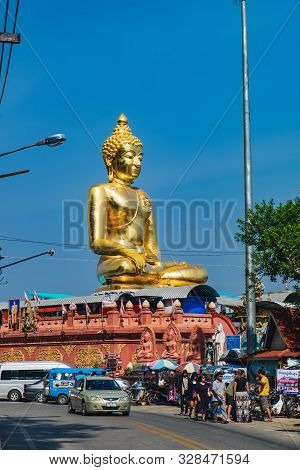 Chiang Rai, Thailand - February 10, 2018: Tourists Visit Big Golden Buddha Statue At Golden Triangle