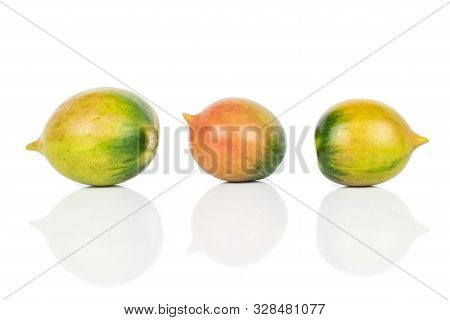 Group Of Three Whole Fresh Tomato De Barao Isolated On White Background